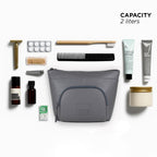 Grey Eiko pouch with toiletries and grooming essentials, showcasing minimalist design and compact storage.