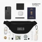 Black fanny pack with various everyday items, showcasing 1.4 liters capacity for essentials like phone, wallet, and passport.