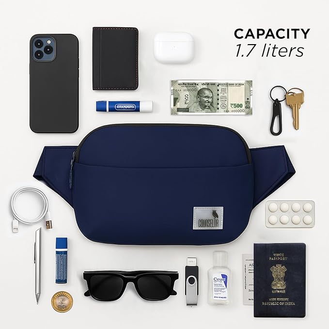 The Avelin navy waistpack with essentials: phone, wallet, keys, and more, showcasing its compact 1.7-liter capacity.