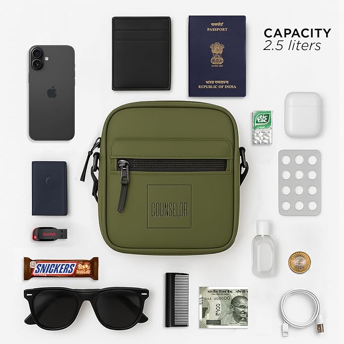 Olive green Noma side sling bag with various everyday essentials arranged around it, showcasing its compact design.