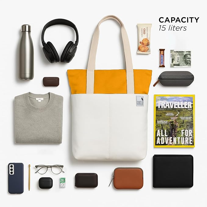 The Skylin tote bag in off-white and yellow, surrounded by a water bottle, headphones, and essential items, showcasing its modern design.