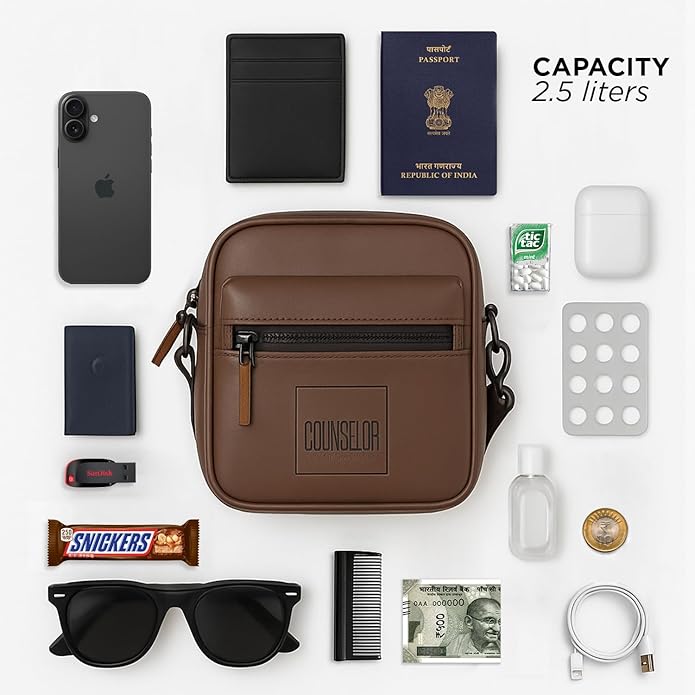 Brown Noma bag with essentials like phone, wallet, passport, and sunglasses, showcasing stylish and compact design.