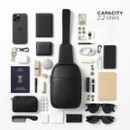 Flat lay of the Kiro Crossbody Bag with various personal items, showcasing its 2.2-liter capacity for efficient organization.