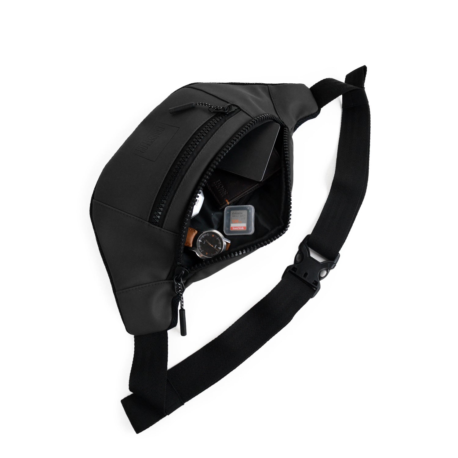 Stylish black waist bag made from vegan leather, ideal for daily use, showcasing its interior and organization features.