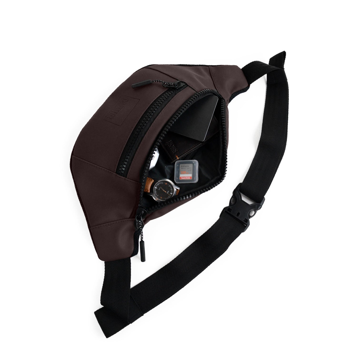 Stylish brown waist bag made from vegan leather, ideal for daily use, showcasing its interior and organization features.