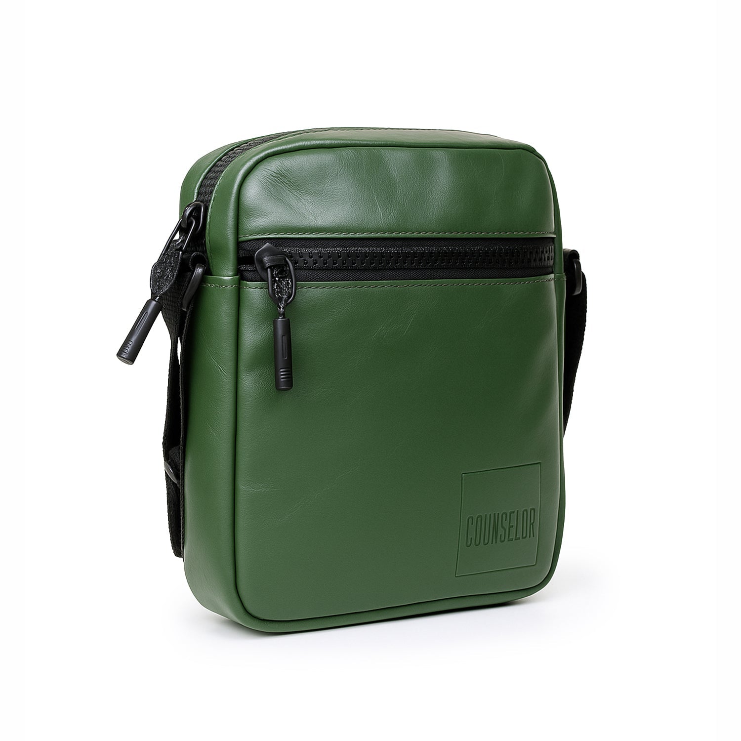Stylish green sling bag made of vegan leather with adjustable strap and front zipper pocket.