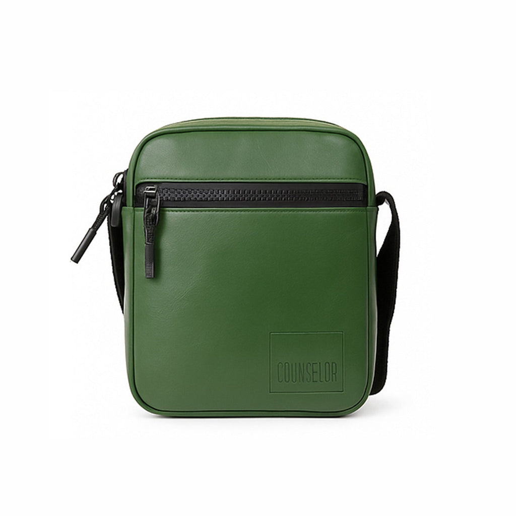 Stylish green crossbody bag made from vegan leather with adjustable strap and front zipper pocket.