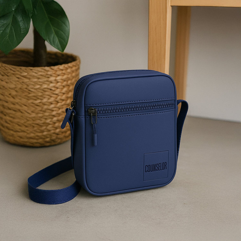 Stylish navy crossbody bag with zipper pocket and adjustable strap, perfect for daily use and travel.