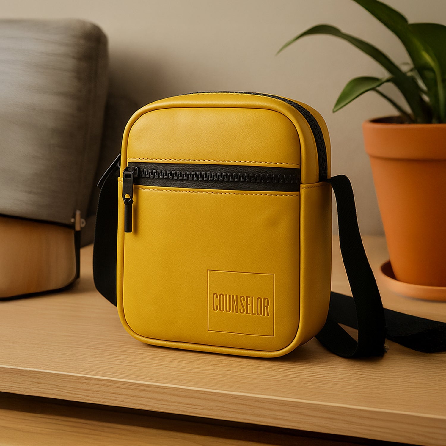 Stylish mustard-yellow sling bag made of vegan leather, perfect for daily use and travel with adjustable strap.