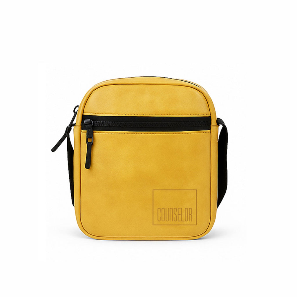 Stylish mustard yellow vegan leather sling bag with a front zipper pocket and adjustable strap.