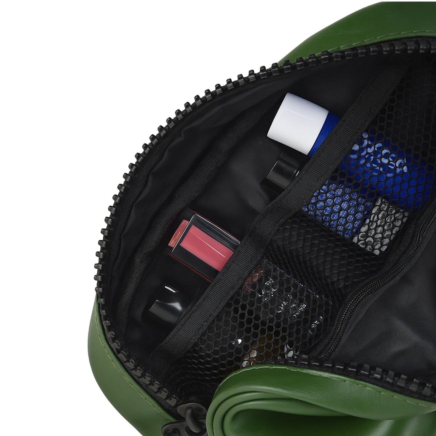 Interior view of The Swift Green Toiletry Kit showcasing organized travel essentials in mesh pockets.