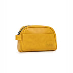 Chic mustard toiletry bag made from vegan leather, featuring a zippered closure and convenient side handle.