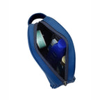 Open navy toiletry kit showcasing organized grooming essentials inside.