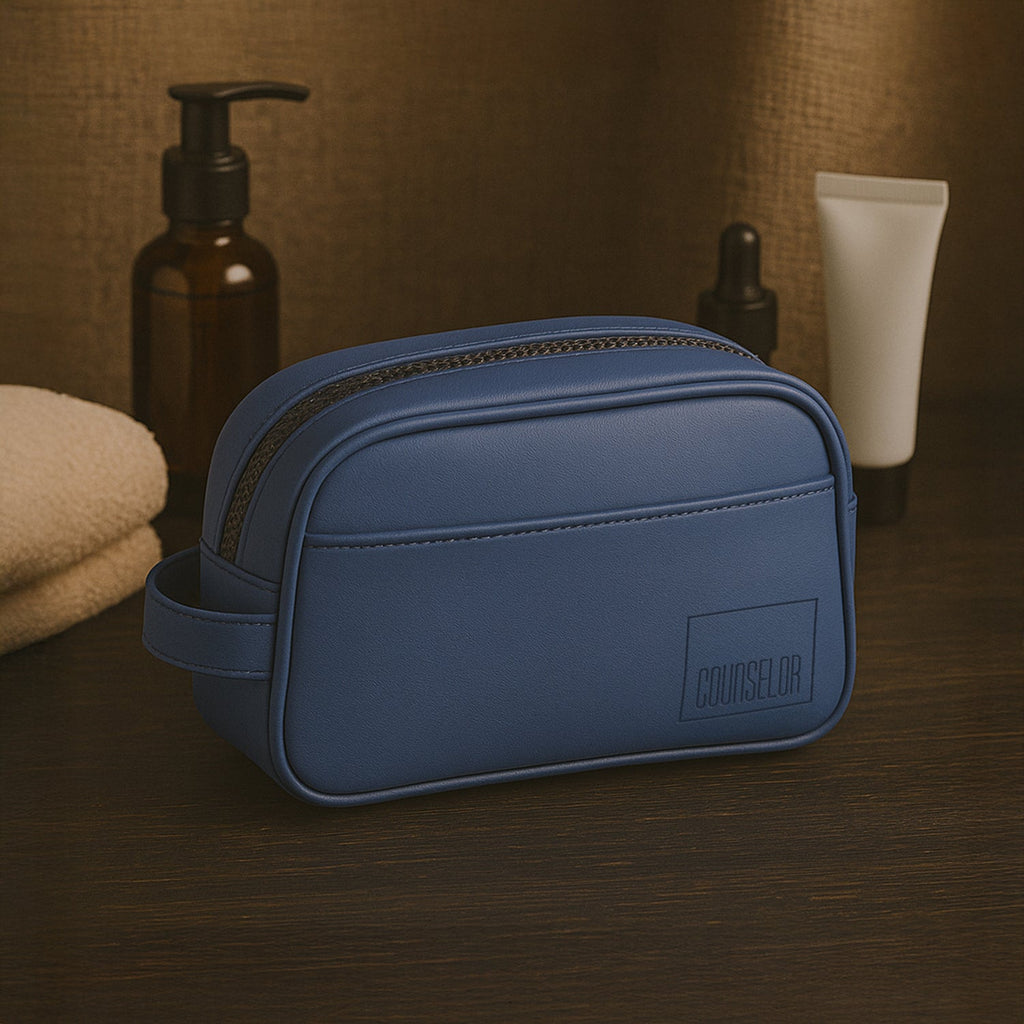 Chic navy toiletry kit made from vegan leather, featuring a zippered closure and durable design, ideal for travel and daily use.