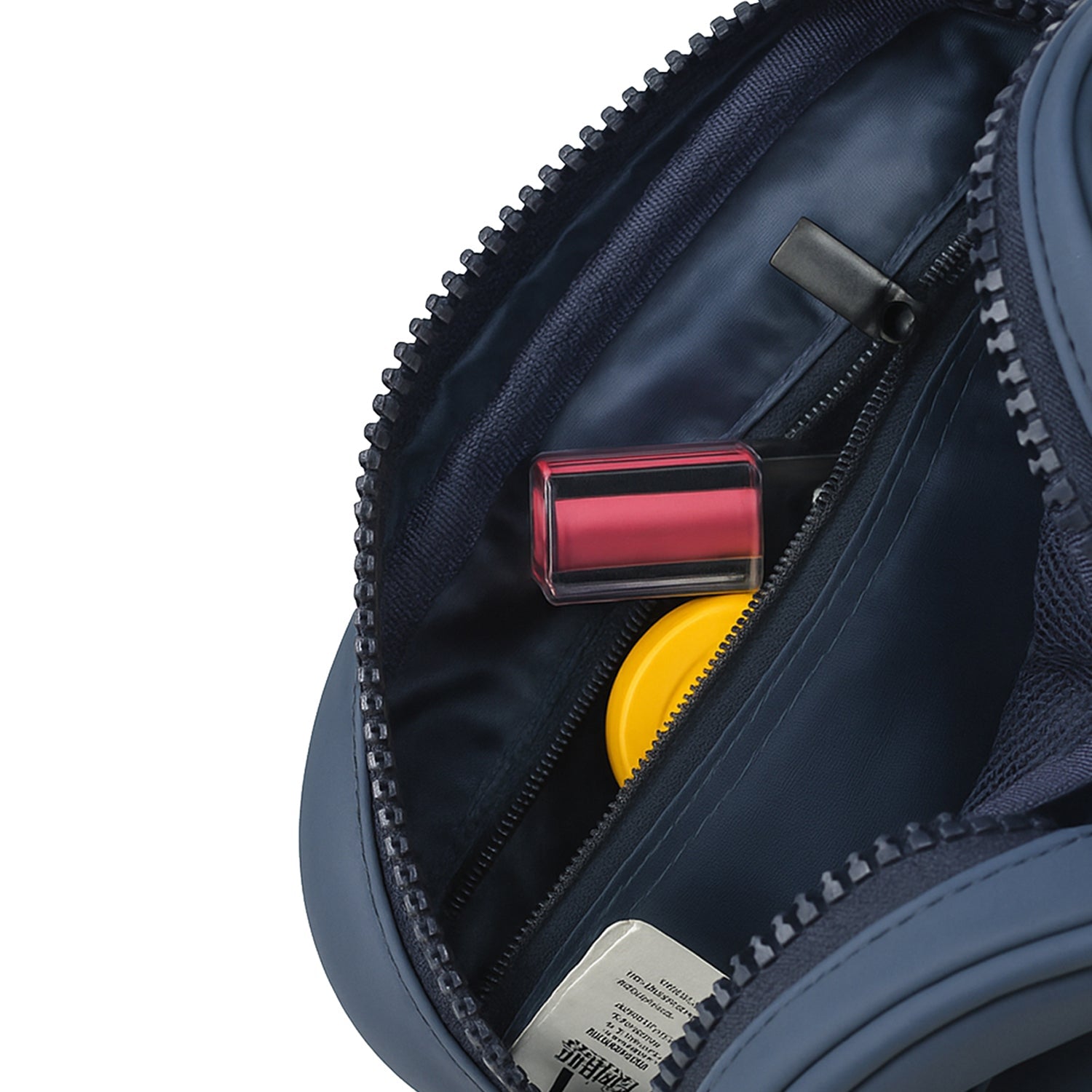Interior view of the Swift Toiletry Kit in Navy, showcasing organized toiletries and zippered compartments.