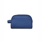 The Swift Toiletry Kit in navy, crafted from vegan leather with a spacious design for travel essentials.