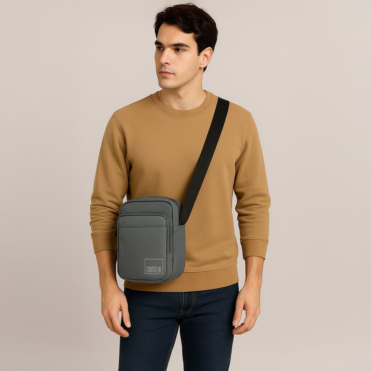 Man wearing the Luno Grey Sling Bag, showcasing its stylish design and adjustable shoulder strap.
