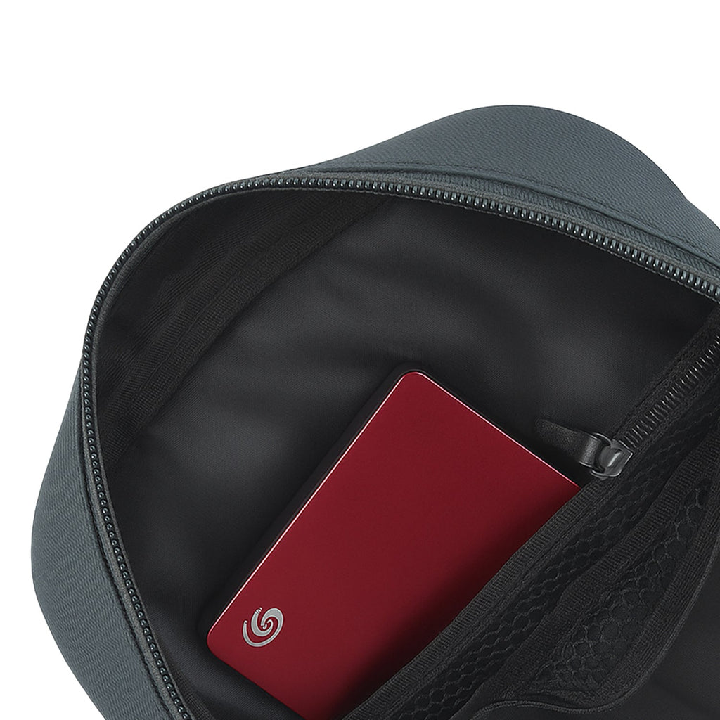 Inside view of Luno Grey bag showing a red external hard drive in main compartment.