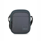 Stylish grey crossbody bag with adjustable strap and smooth zippered pockets for organization.