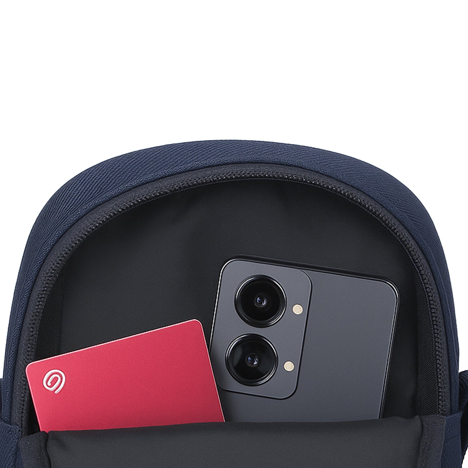 Navy blue bag interior showcasing a phone and a card, highlighting smart organization features.