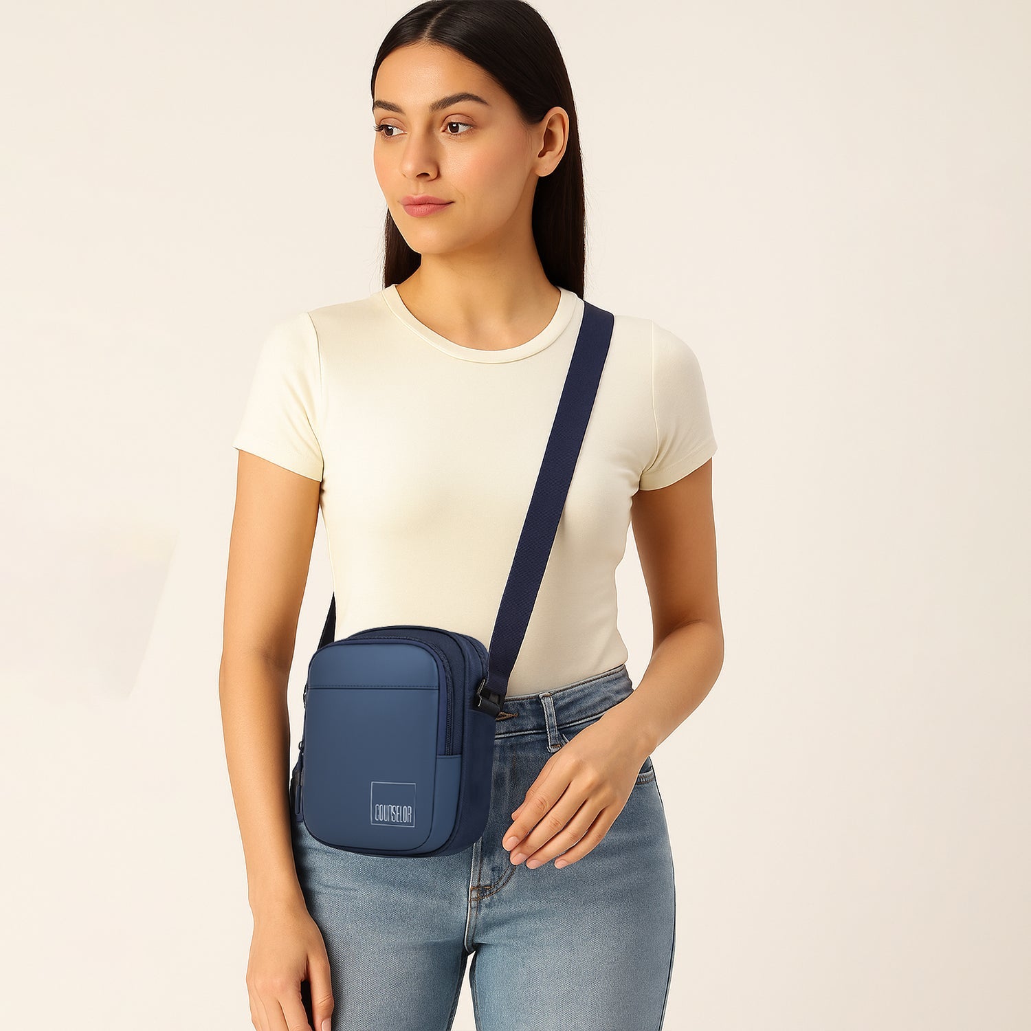 Woman wearing The Luno Navy Blue Sling Bag, showcasing a stylish and functional design for everyday use.