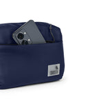Navy The Avelin waistpack with smartphone in a pocket, showcasing smart storage and compact design for everyday use.