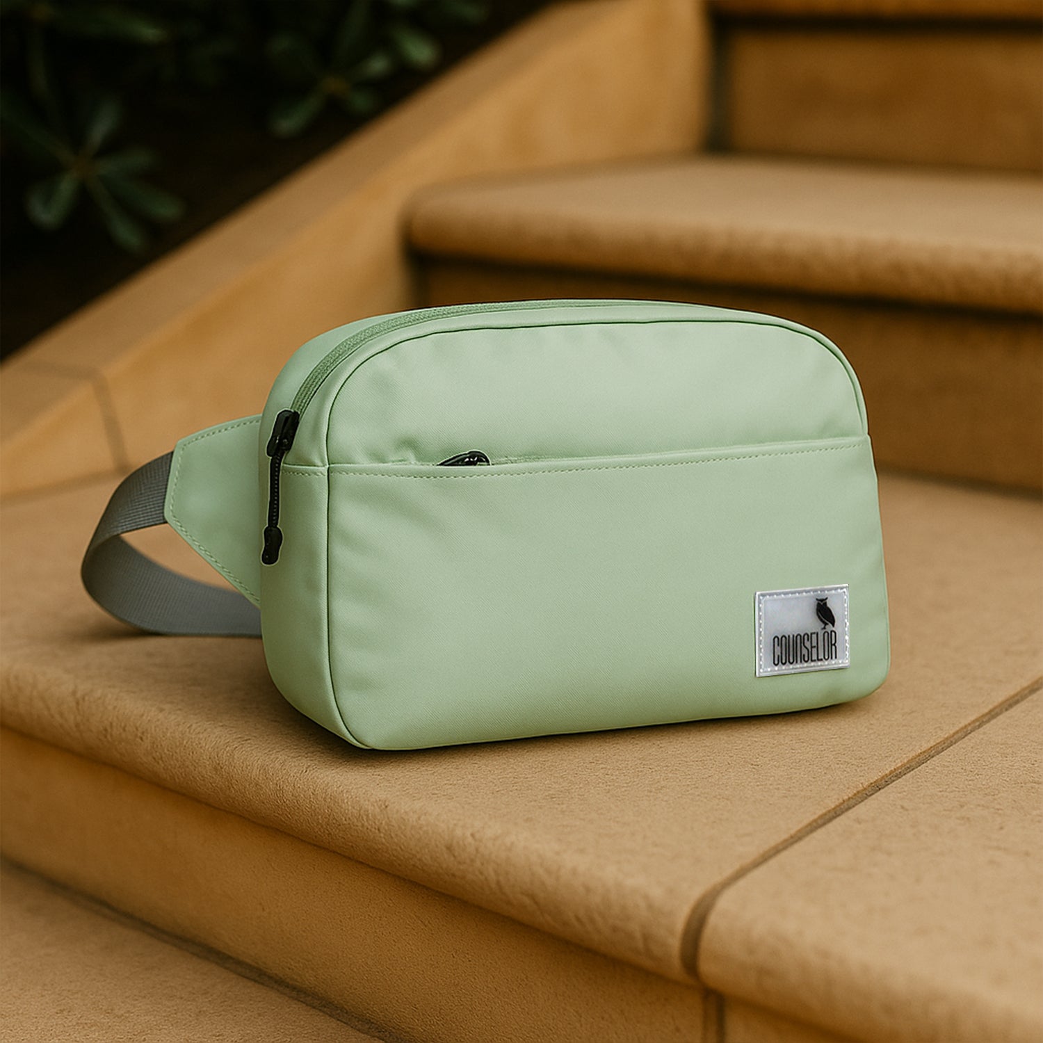 The Avelin waistpack in pista green, showcasing a minimalist design, perfect for daily essentials and versatile wear.
