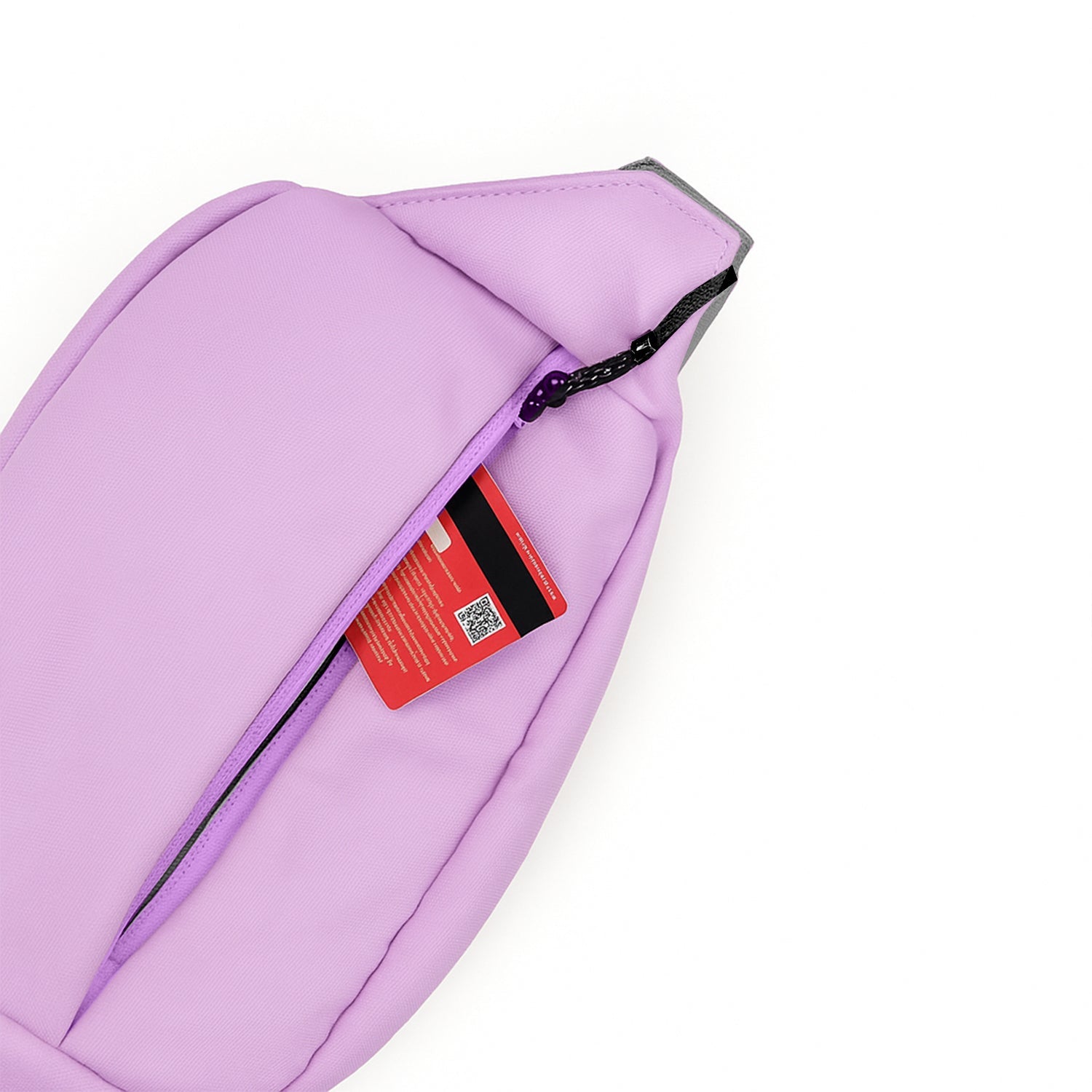 Close-up of The Avelin waistpack in pink showing a zippered pocket with a card inside.