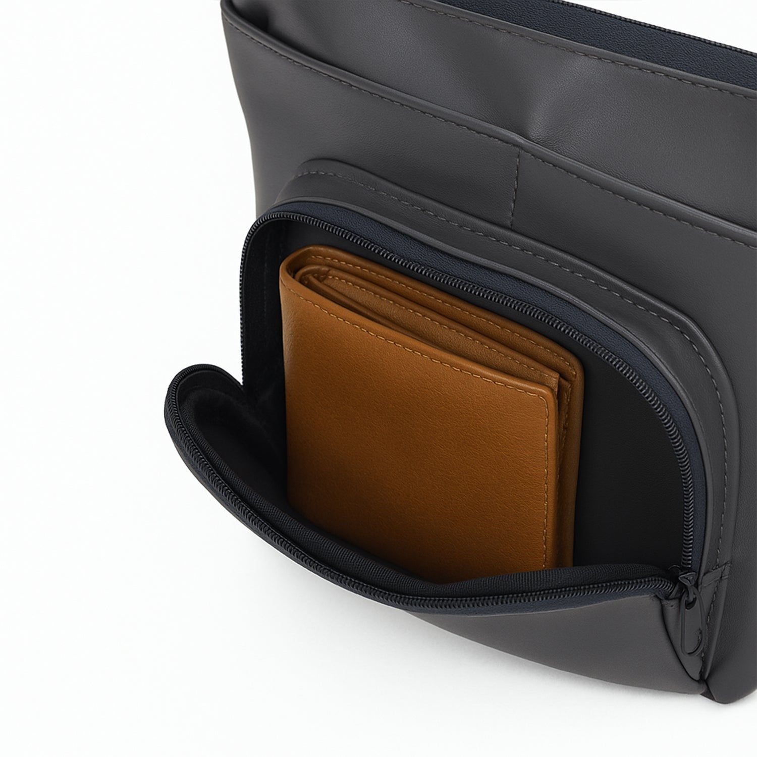 Close-up of The Eiko - Grey pouch showing its compact storage with a wallet in the internal pocket.