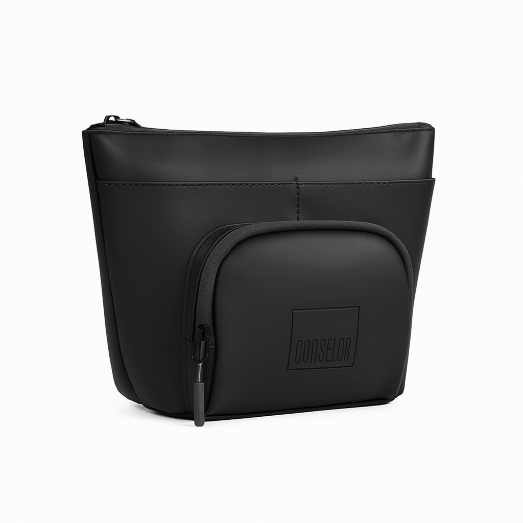 The Eiko pouch in black, featuring minimalist design and compact storage for essentials.