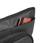 Close-up of the Eiko black pouch showing a credit card in the internal pocket, highlighting its compact storage design.