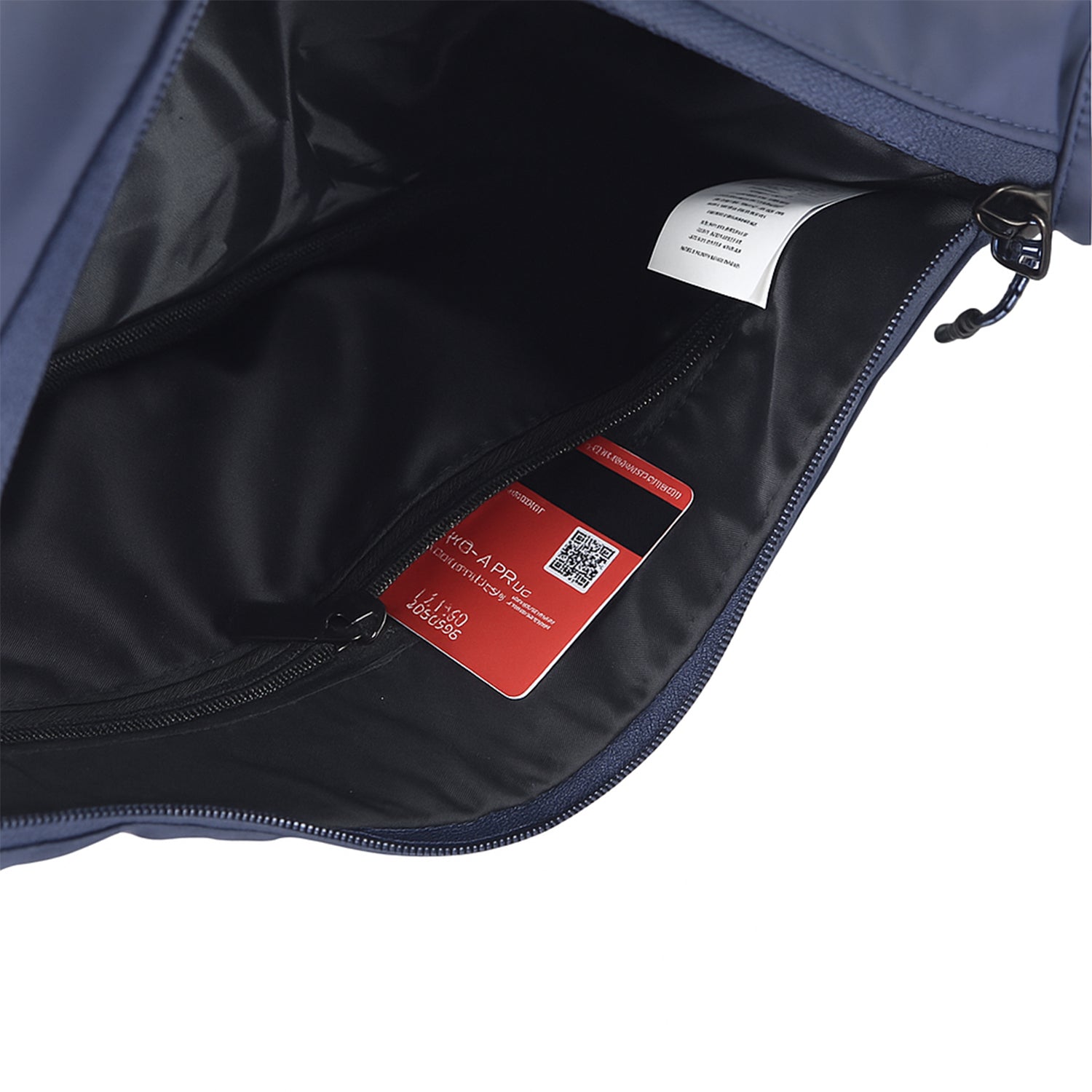 Interior view of The Zuki navy side sling bag, showcasing its organizational slip pocket and smooth zipper for easy access.