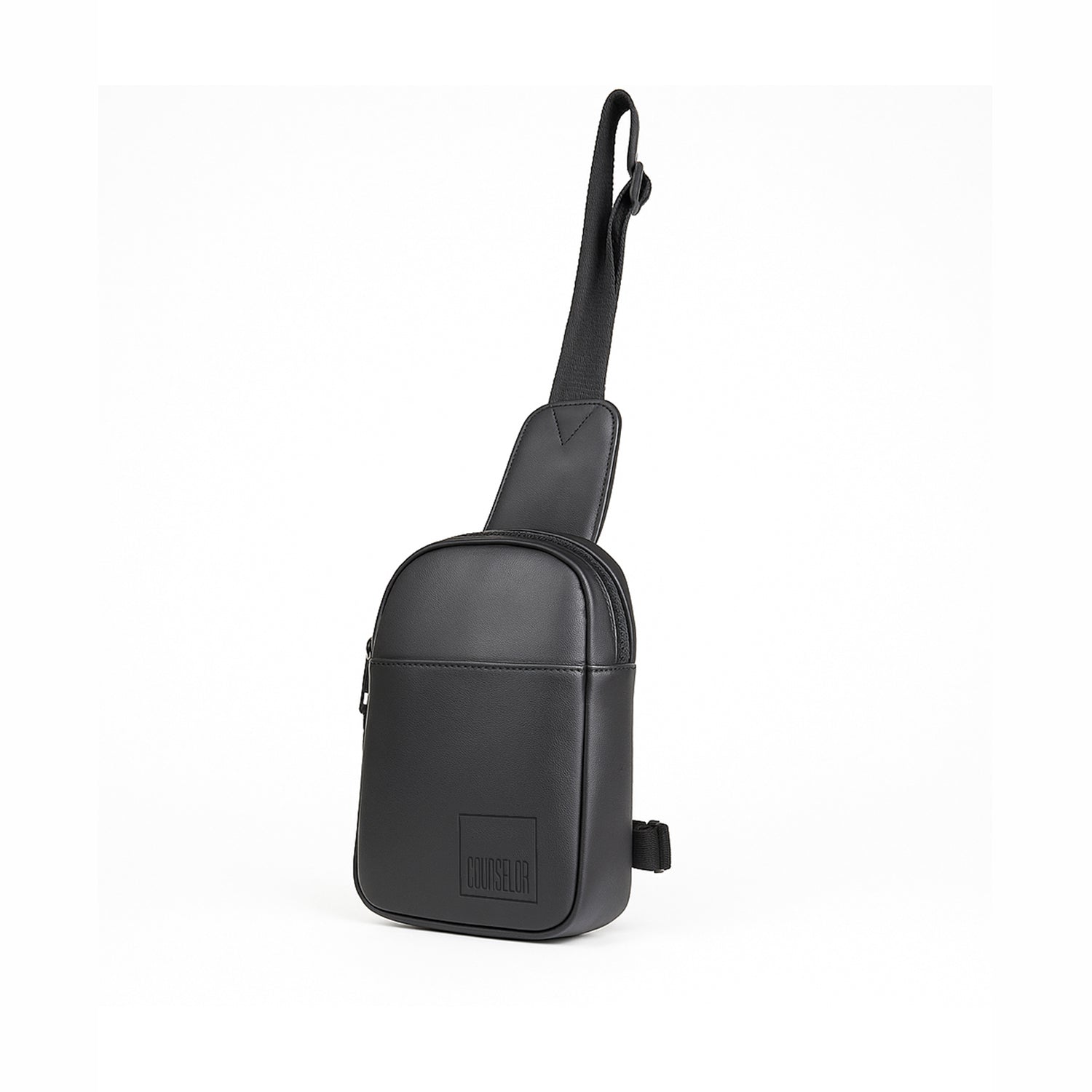 Stylish black crossbody bag made from vegan leather with adjustable strap and multiple compartments.