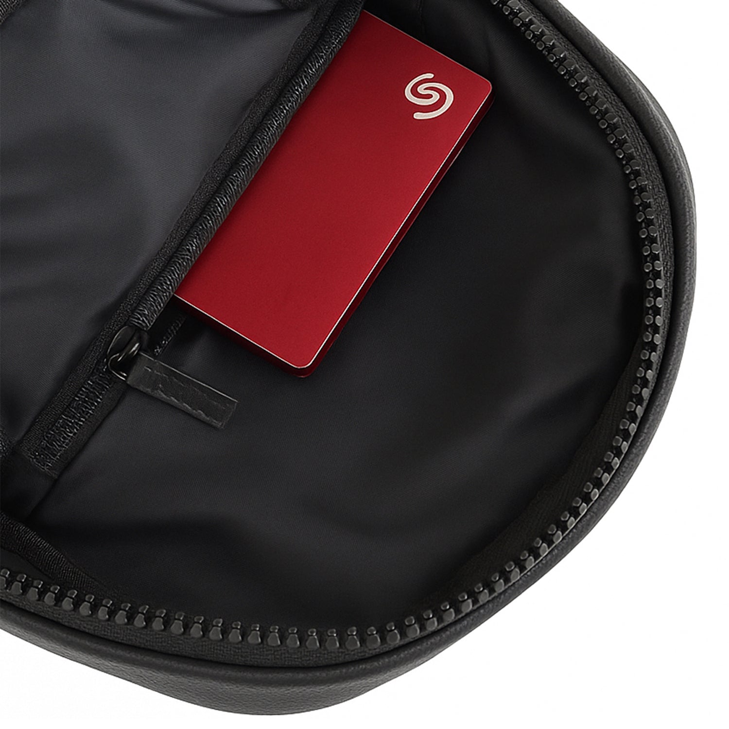 Interior of the Kiro Crossbody Bag featuring a zippered pocket with a card inside, showcasing its efficient organization.