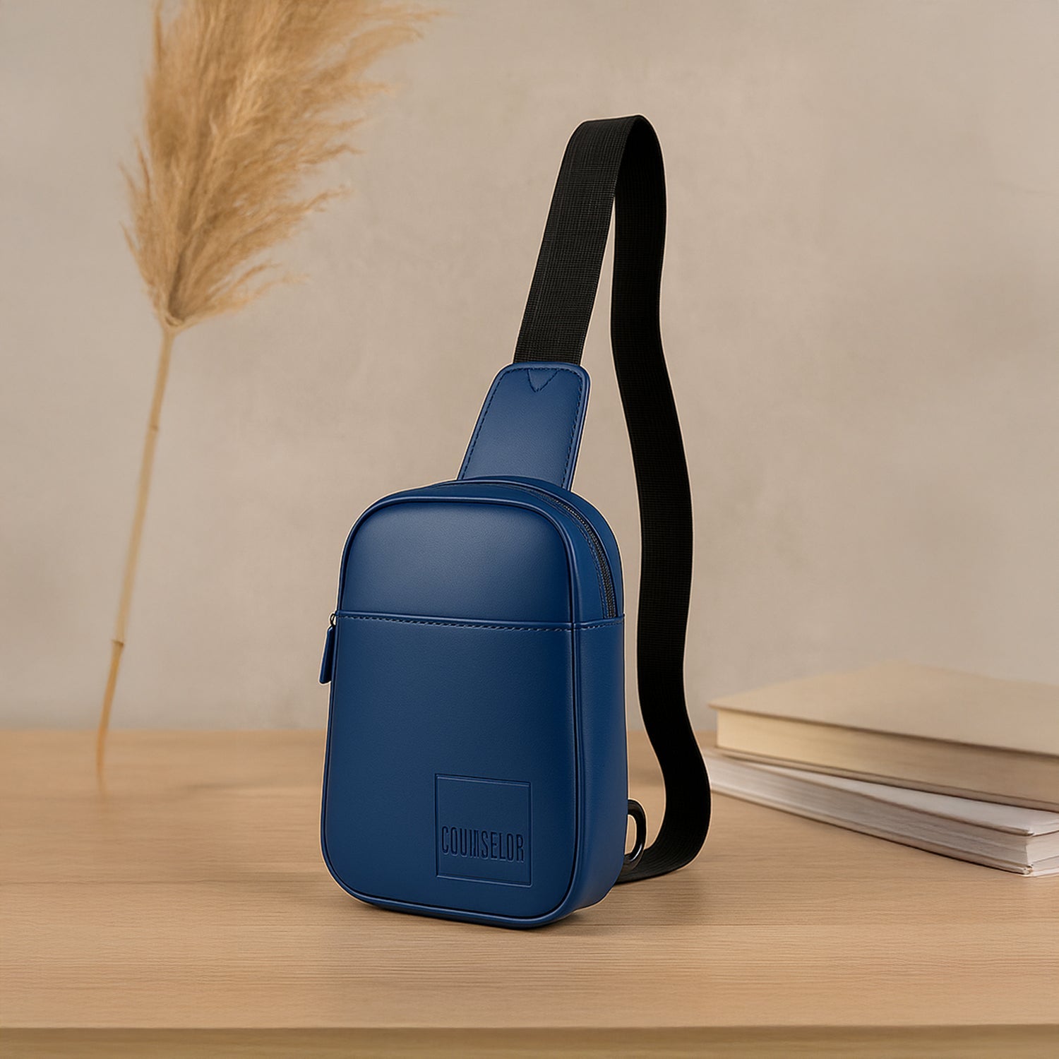 The Kiro Crossbody Bag in navy, featuring a stylish vegan leather design and adjustable strap.