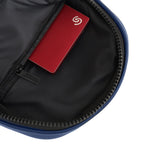 Interior view of the Kiro Crossbody Bag showing a red card in a zippered pocket.