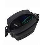 Open view of the Noma Black bag showing Nikon camera accessories inside, highlighting its compact design and efficient organization.