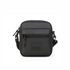 The Noma Black bag featuring a stylish design, front zipper pocket, and adjustable strap for versatile use.
