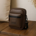 Stylish brown vegan leather bag with front zipper pocket, perfect for daily use and travel.