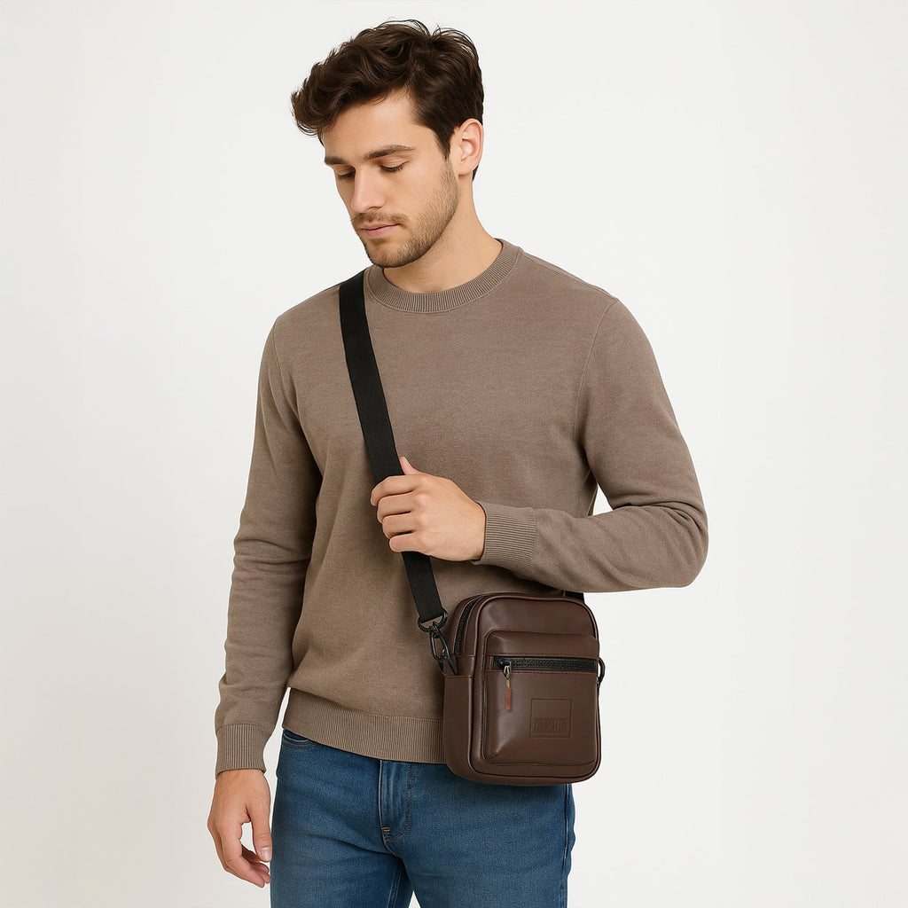 Model wearing The Noma brown sling bag, showcasing its stylish design and adjustable strap.