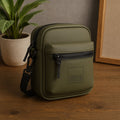 Stylish olive green bag with zipper pocket and adjustable strap, ideal for daily use and travel.