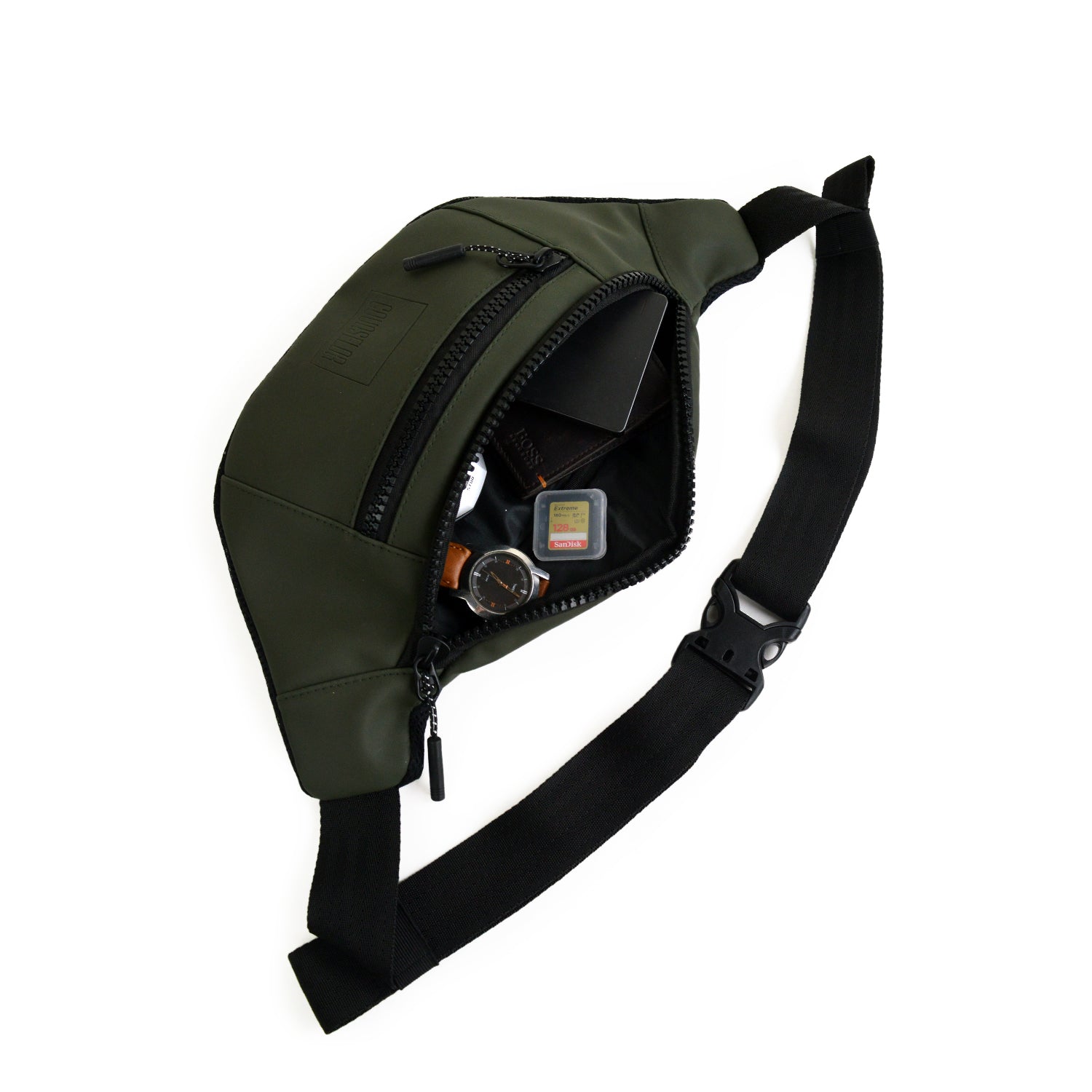 Stylish olive waist bag made from vegan leather, ideal for daily use, showcasing its interior and organization features.