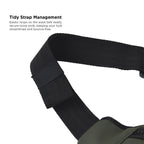 Close-up of Tidy Strap Management on an olive vegan leather waist bag, showcasing elastic loops for a streamlined look.