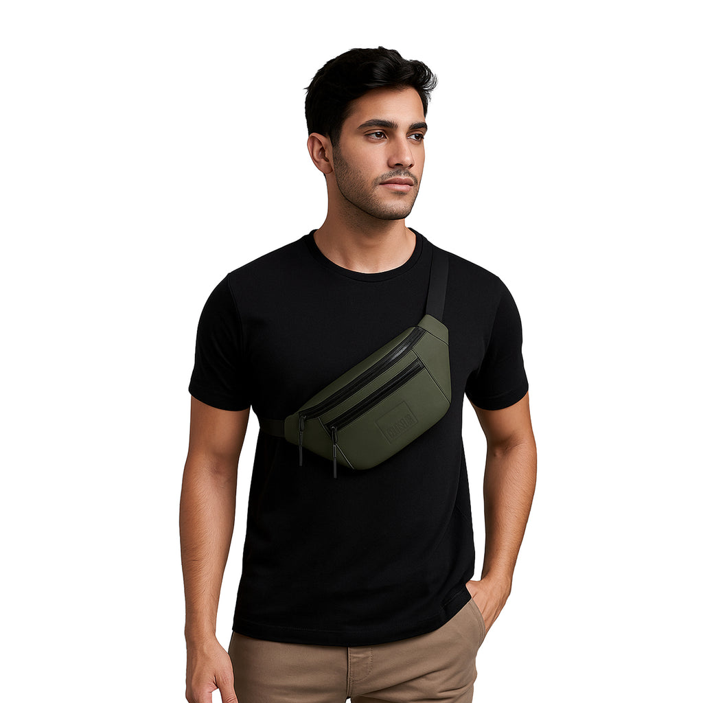 Man wearing a black shirt with an olive green waist bag, a stylish fanny pack made of vegan leather for daily use.