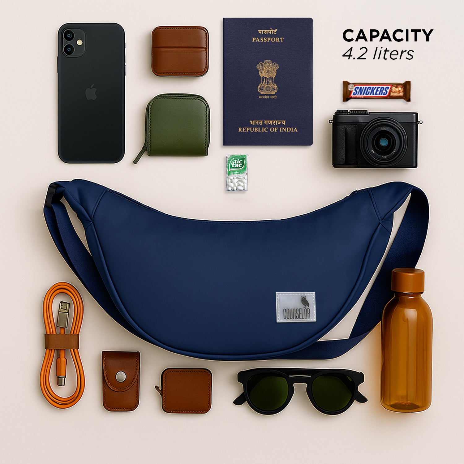 The Zuki Navy side sling bag surrounded by essential travel items, showcasing its compact design and 4.2-liter capacity.